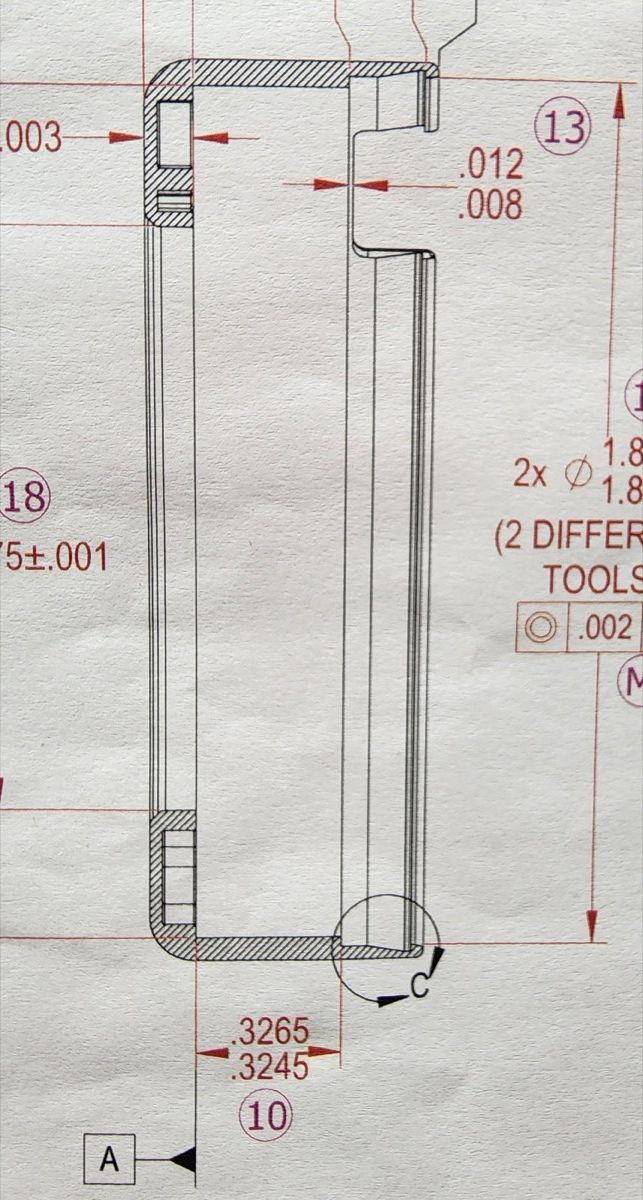 Engineering blueprint showing precision tolerances and cross-section