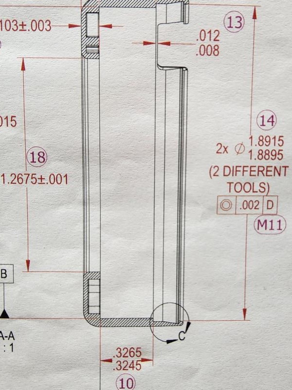 Section of a mechanical technical drawing showing various dimensions and callouts on a white background.